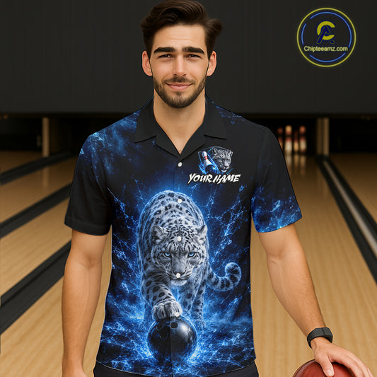 Man wearing a bowling shirt with a blue and black design of a leopard and bowling ball on a bowling alley.