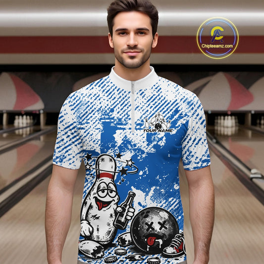 Male model in a bowling lane wearing a blue and white quarter-zip shirt, humorous drunk bowling pin illustration holding beer and bowling ball.