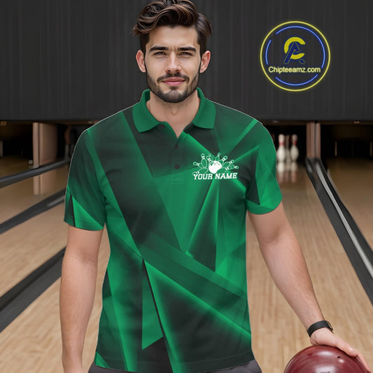 Man in a green bowling shirt with a logo in a bowling alley