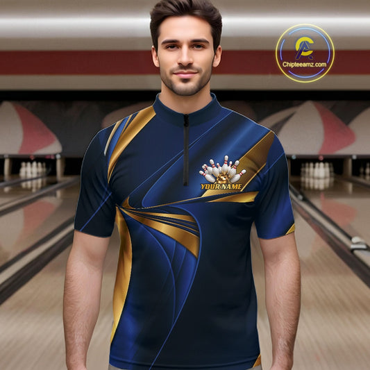 A man wearing a custom bowling jersey in a bowling alley. The jersey is dark blue with gold and gray graphic patterns and a custom name on the chest.