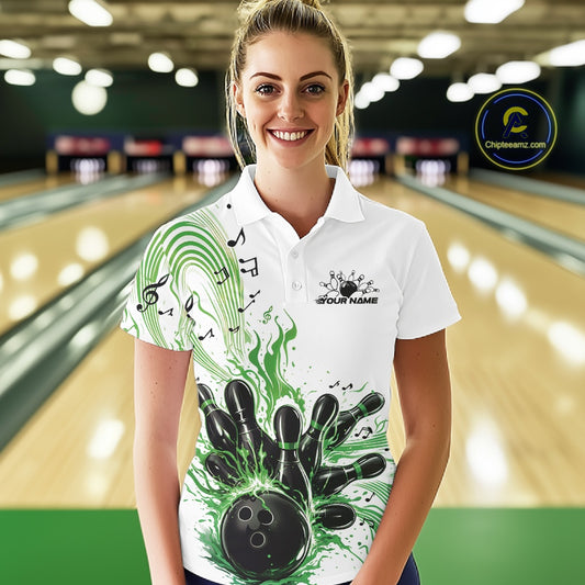 Female model wearing a white and green bowling polo shirt at the lane with music-inspired bowling graphics and wave accents.