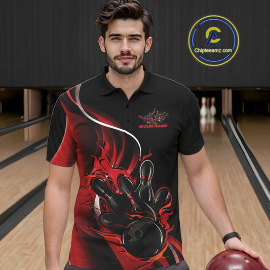 Male model seen from the front in a bowling lane wearing a black and red polo shirt featuring a flame bowling ball striking pins in an energetic action scene.