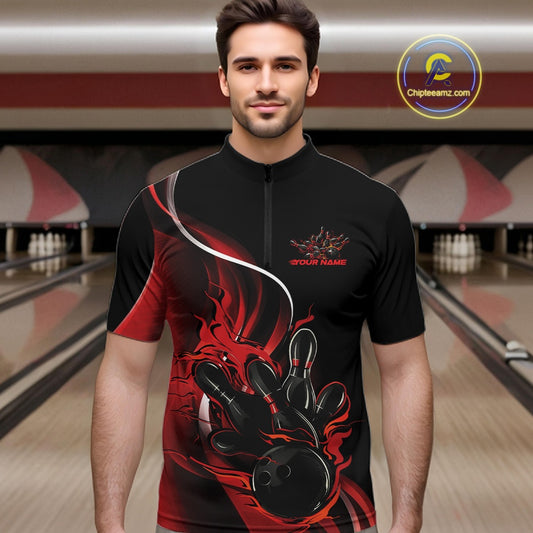 Male model front view at bowling lane wearing black and red quarter zip shirt featuring flame bowling action artwork