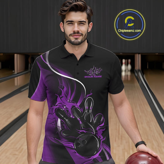 Male model seen from the front in a bowling lane wearing a black and purple polo shirt featuring a flame bowling ball striking pins in a dynamic sports scene.