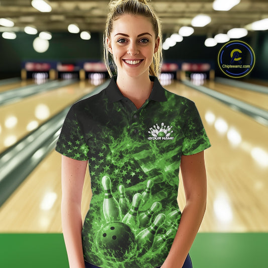 Female model wearing a black and green bowling polo in a bowling lane with fiery bowling strike artwork and patriotic accents.