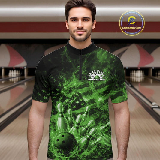 Male model wearing a black and green bowling quarter-zip in a bowling lane with fiery bowling strike artwork and patriotic accents.