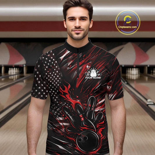 Male model wearing a black and red bowling quarter-zip shirt at a bowling lane with fiery bowling action artwork and patriotic accents.