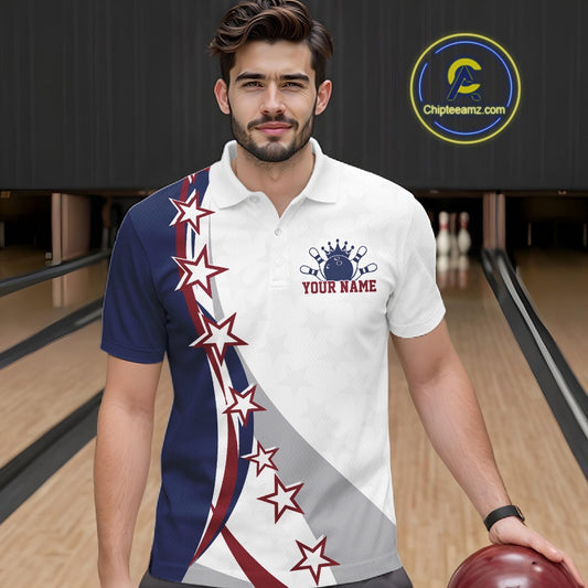 Male model front view at a bowling lane wearing a red, white, and blue bowling polo shirt with sweeping stars and stripe graphics.