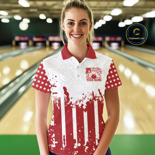 Woman wearing a red and white polo shirt with a graphic design in a bowling alley.