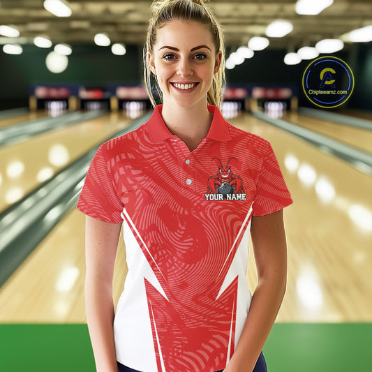 Front view of a female model in a bowling alley wearing a red custom bowling polo shirt with a funny aggressive crawfish holding a bowling ball in a sportswear-style design.