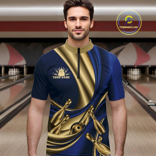 A man wearing a custom bowling shirt with a blue and gold satin-like graphic design, featuring bowling pins and balls, set against a bowling alley background.