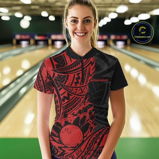 Woman wearing a black and red maori tribal patterned bowling shirt in a bowling alley.