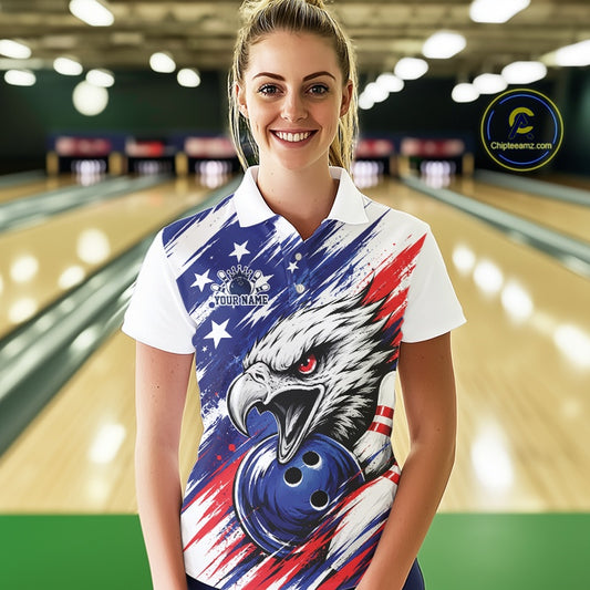 Woman wearing a bowling shirt with an eagle and American flag design in a bowling alley.