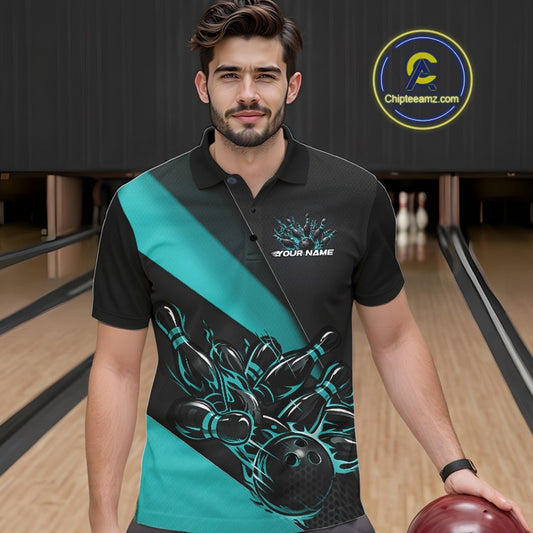 Male model seen from the front in a bowling lane wearing a black and turquoise blue polo shirt featuring a flame bowling ball striking pins in a dynamic sports scene.