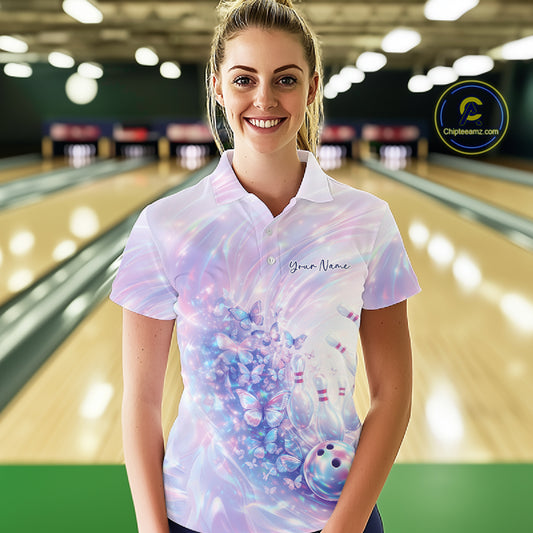 Front view of a female model in a bowling polo featuring pastel purple and pink holographic butterfly graphics and bowling accents