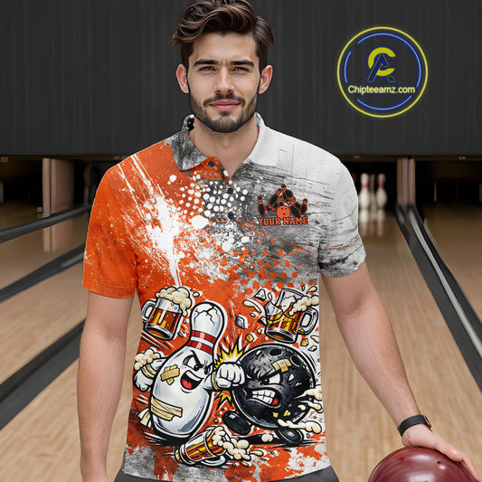 Front view of a male model in a bowling lane wearing an orange and white grunge splatter polo shirt with funny bowling ball and pin battle illustration.