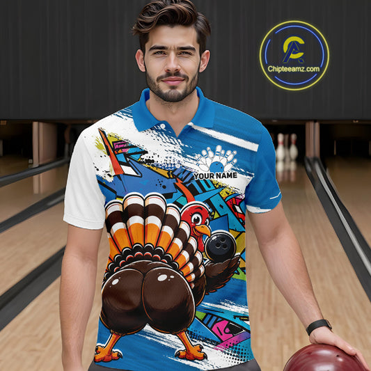 Front view of a male model wearing a blue custom bowling polo shirt featuring a funny graffiti style turkey holding a bowling ball, paint splatter details, and a custom name in a bowling alley.