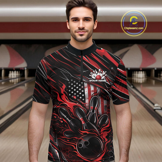 Male model at a bowling lane wearing a black and red bowling quarter-zip shirt with bowling strike artwork and patriotic flame details.