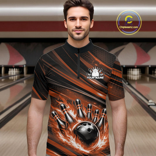 Male model wearing a black and orange bowling quarter-zip shirt at a bowling lane with fiery bowling action artwork and dynamic stripe accents.