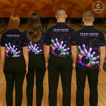 Load image into Gallery viewer, Four people wearing black shirts with colorful bowling designs and 'TEAM NAME' text on a bowling alley background.