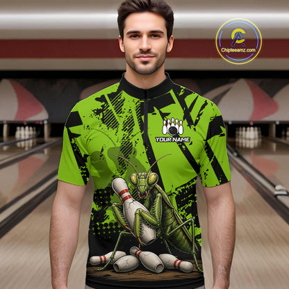 A man wearing a bright green and black bowling-themed short-sleeve shirt with a large praying mantis graphic and bowling pins, standing in front of a blurred bowling alley background. 