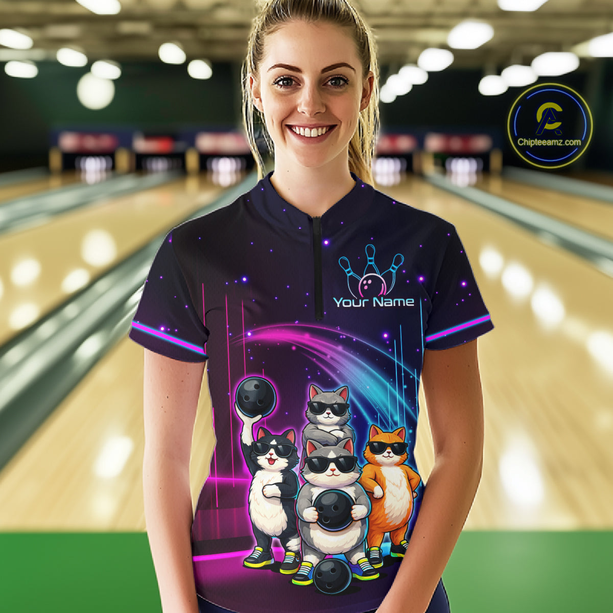 Person wearing a custom bowling shirt with cartoon cats design in a bowling alley.