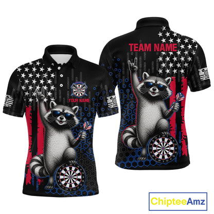 Front and back views of a black short-sleeve polo shirt featuring a raccoon graphic, stars, red and blue flag elements, dartboard designs, and customizable text areas including 'TEAM NAME' and 'YOUR NAME'.