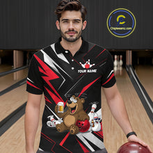 Load image into Gallery viewer, Man wearing a black bowling-themed shirt with a bear design in a bowling alley.
