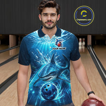 Load image into Gallery viewer, Man wearing a blue polo shirt with a shark and bowling ball design in a bowling alley.