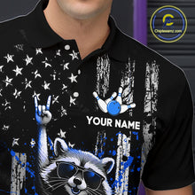 Load image into Gallery viewer, Black polo shirt with a raccoon wearing sunglasses, rock hand gesture, and blue bowling ball design. 'Your Name' text space.