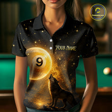 Load image into Gallery viewer, A woman wearing a black short-sleeve polo shirt with a custom cosmic billiards design. The shirt features a large golden pool ball with the number 9, a howling wolf, and the text 'YOUR NAME' and 'CHOOSE NAME'.