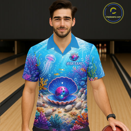 Man wearing a bowling shirt with an underwater design in a bowling alley.