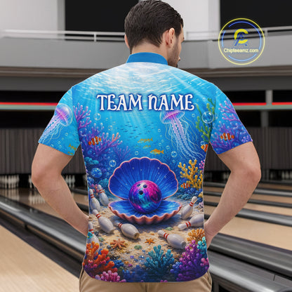 Man wearing a colorful bowling shirt with an underwater scene design in a bowling alley.