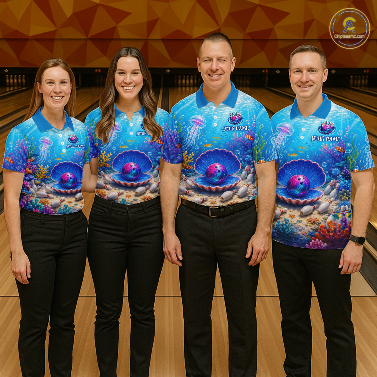 Four people wearing matching blue bowling shirts with a colorful design in a bowling alley.