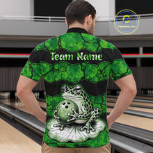 Load image into Gallery viewer, A man viewed from behind wearing a short-sleeve bowling shirt with a green and black frog graphic holding a bowling ball, with the text 'Team Name' across the upper back. Bowling lanes are visible in the background, and a 'ChuteStream3.