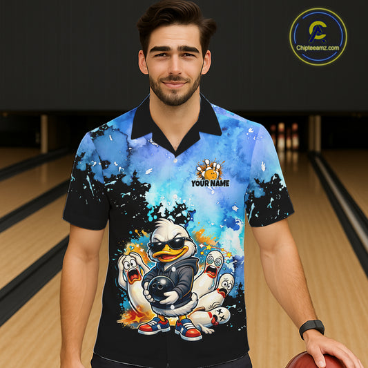 Person wearing a colorful bowling-themed shirt with cartoon characters in a bowling alley.