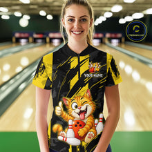 Load image into Gallery viewer, Female model wearing a custom black yellow cat bowling quarter-zip shirt front view featuring a playful cartoon cat, bowling ball, bowling pins and yellow black paint stroke pattern at the bowling alley