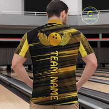 Load image into Gallery viewer, Male model wearing a custom black gold bowling quarter-zip shirt back view displaying the personalized team name below a gold bowling ball emblem at the bowling alley