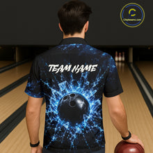 Load image into Gallery viewer, Person wearing a bowling shirt with a blue and black design and 'TEAM NAME' text, holding a bowling ball in a bowling alley.