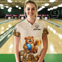 Load image into Gallery viewer, Person wearing a bowling-themed shirt with a bear design in a bowling alley.