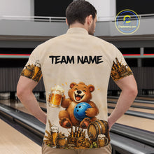 Load image into Gallery viewer, Man wearing a bowling-themed shirt with a bear holding a bowling ball and beer mugs in a bowling alley.