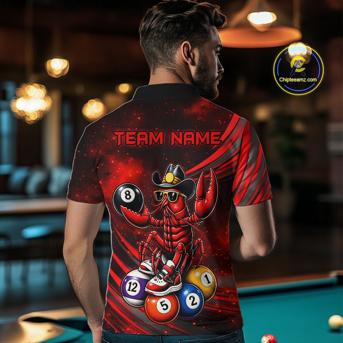 Person wearing a shirt with a crawfish playing pool design in a bar setting
