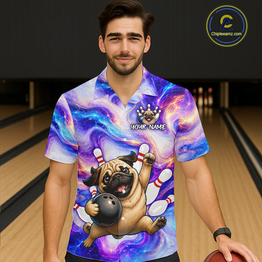 Person wearing a colorful bowling-themed shirt with a pug design in a bowling alley.