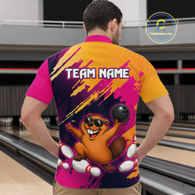 Load image into Gallery viewer, Person wearing a colorful bowling shirt with a cartoon beaver design in a bowling alley.