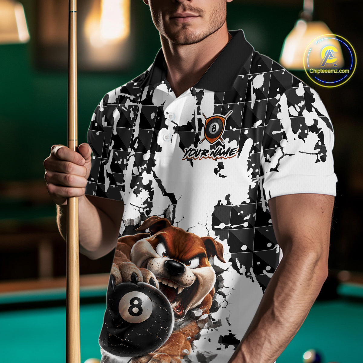 Man holding a pool cue wearing a shirt with a cartoon dog design on a pool table.