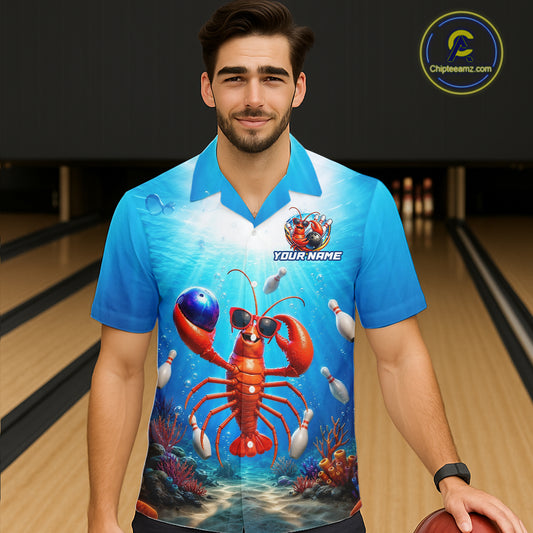 Man wearing a blue bowling shirt with a lobster design in a bowling alley.