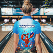 Load image into Gallery viewer, Person wearing a blue bowling shirt with a lobster design and 'TEAM NAME' text in a bowling alley.