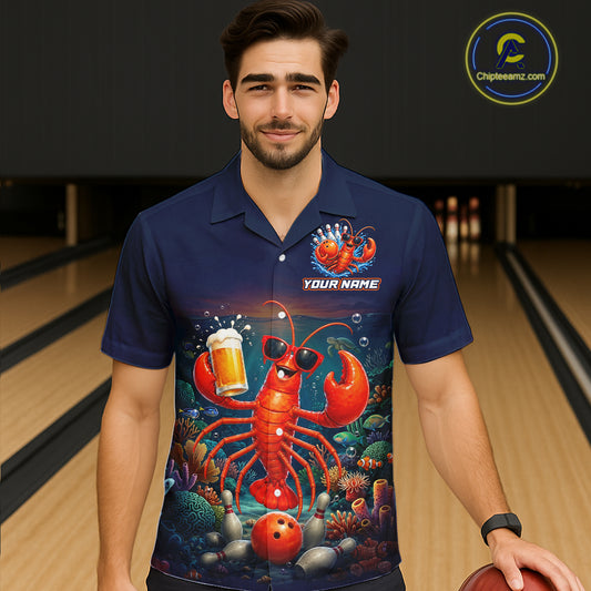 Man wearing a blue polo shirt with a colorful lobster design in a bowling alley.