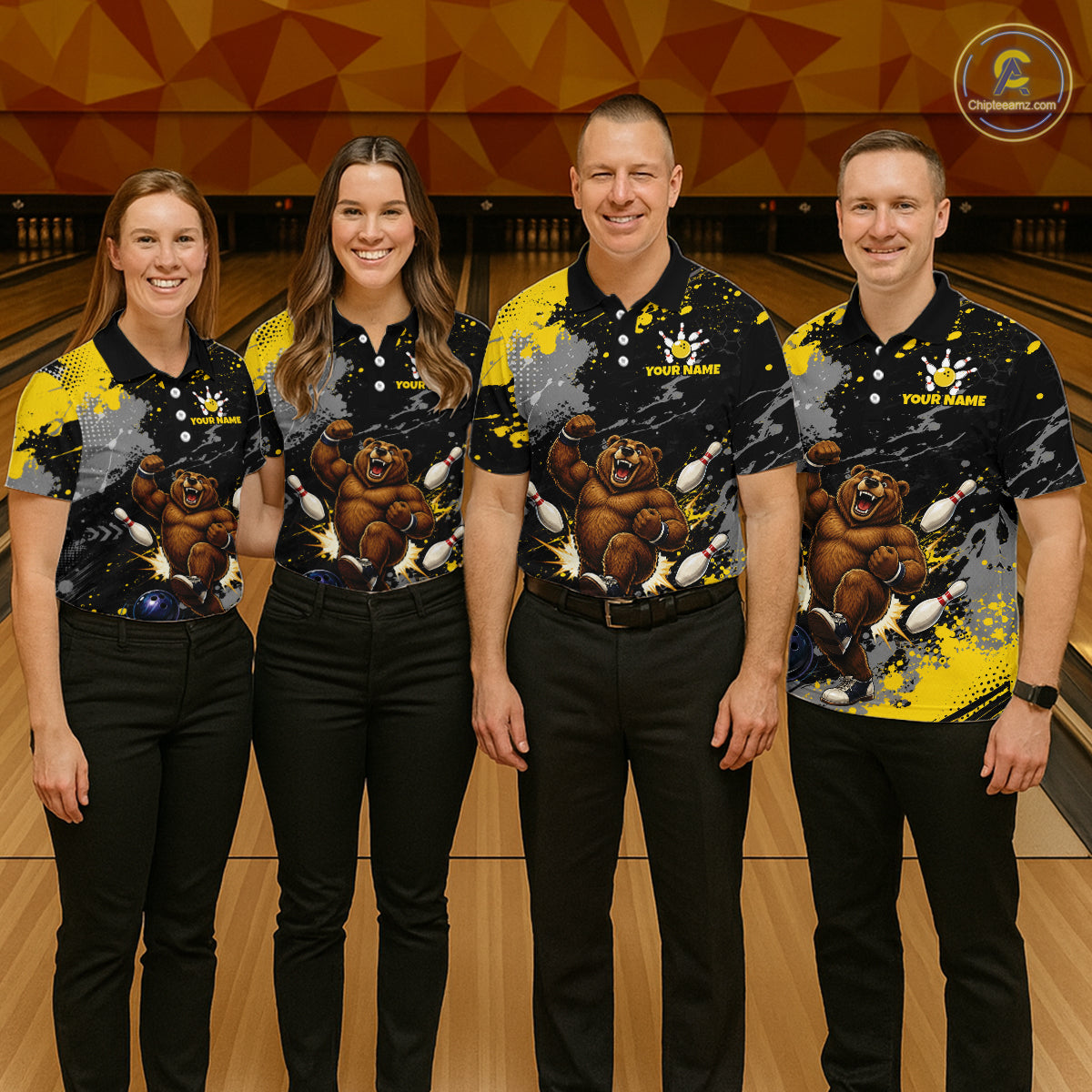 Four people standing in a bowling alley wearing matching custom bowling shirts with a black, yellow, and gray paint-splatter design, featuring a brown bear graphic and the text 'YOUR NAME'.