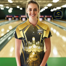Load image into Gallery viewer, Female model wearing a custom black gold bowling polo shirt front view featuring a glowing bowling ball, illuminated bowling pins and gold geometric light beam pattern at the bowling alley